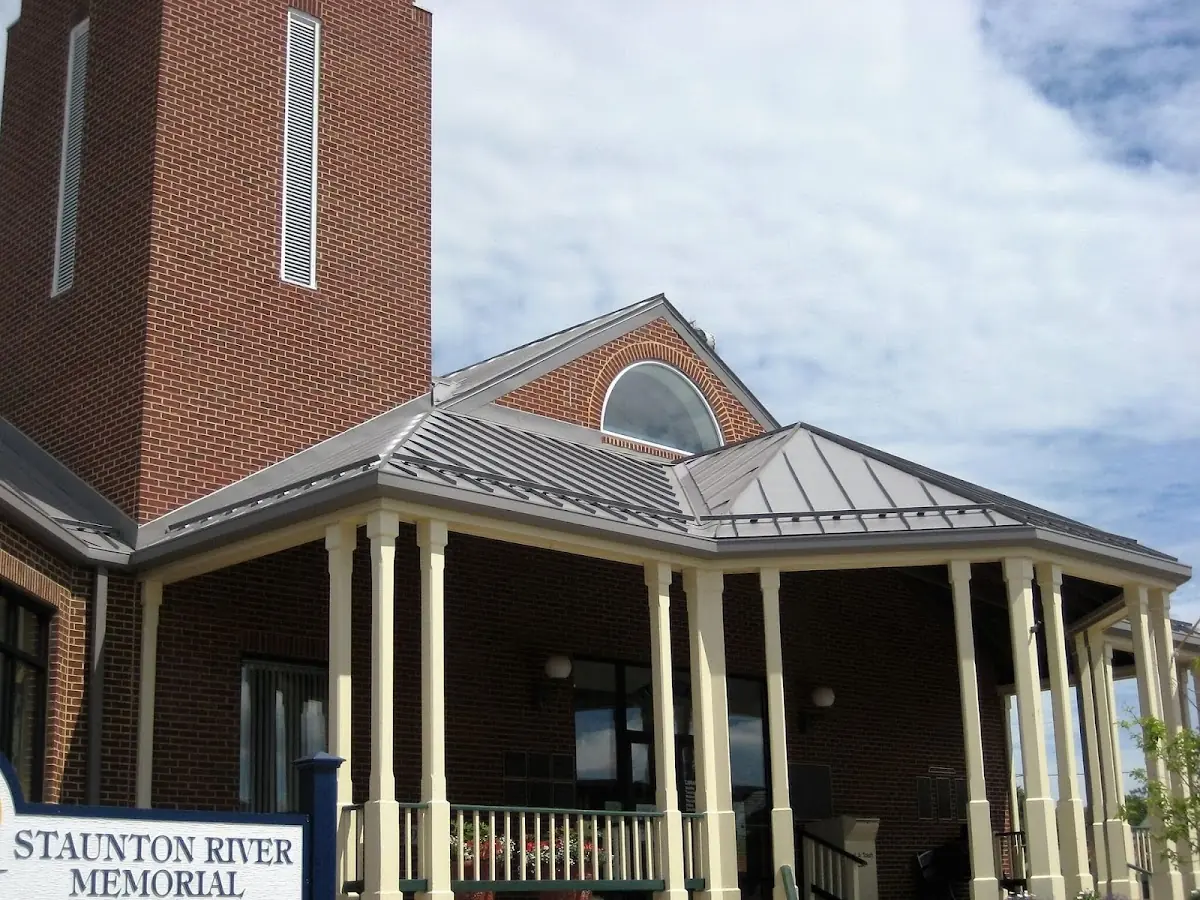 Skilled roofing craftsmen working on a residential roof in Becker